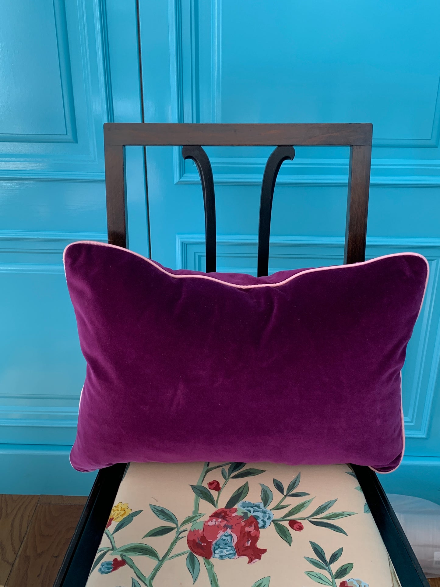 Deep purple velvet lumbar cushion with contrast piping