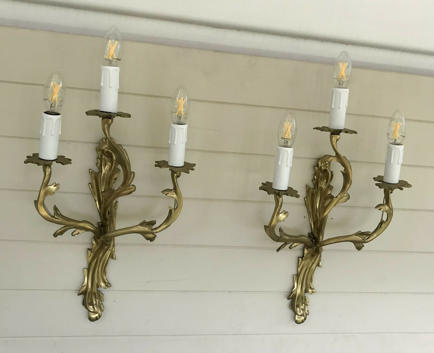 Pair of solid brass rococo wall sconces