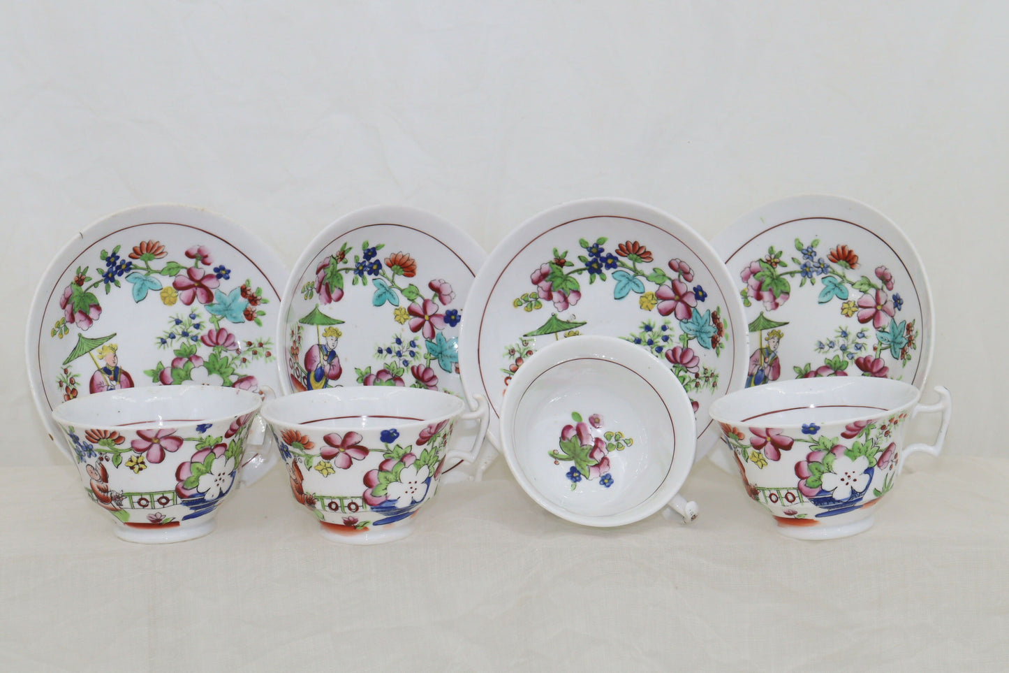 Set of four hand coloured cups and saucers by Hilditch