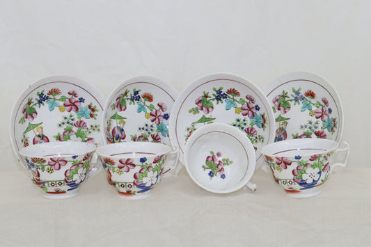 Set of four hand coloured cups and saucers by Hilditch