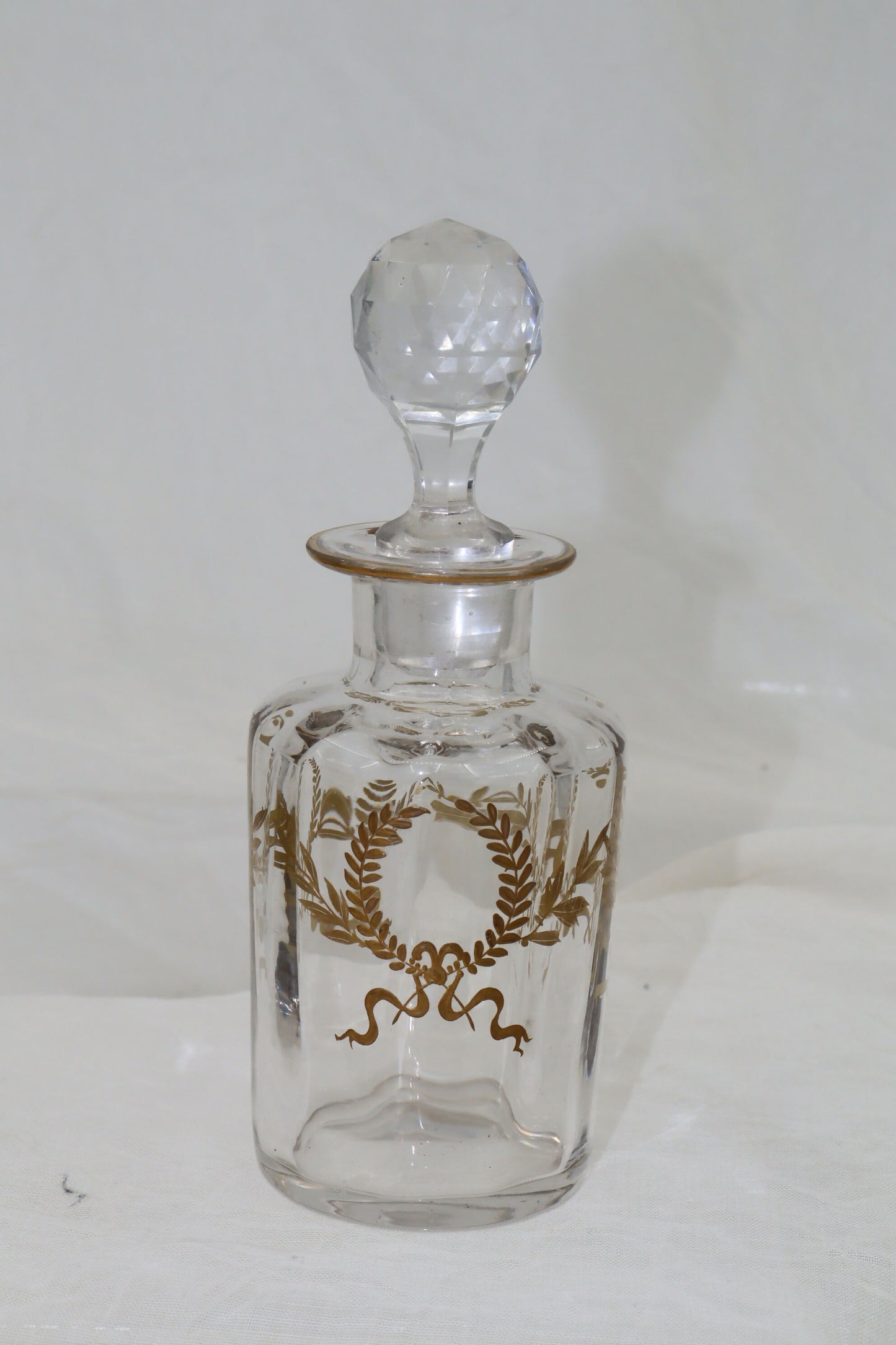 Glass perfume bottle with gilt laurel wreaths