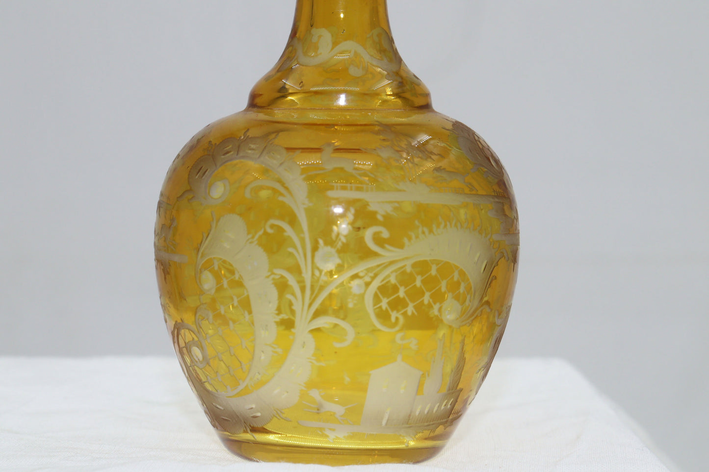 Engraved amber glass perfume bottle