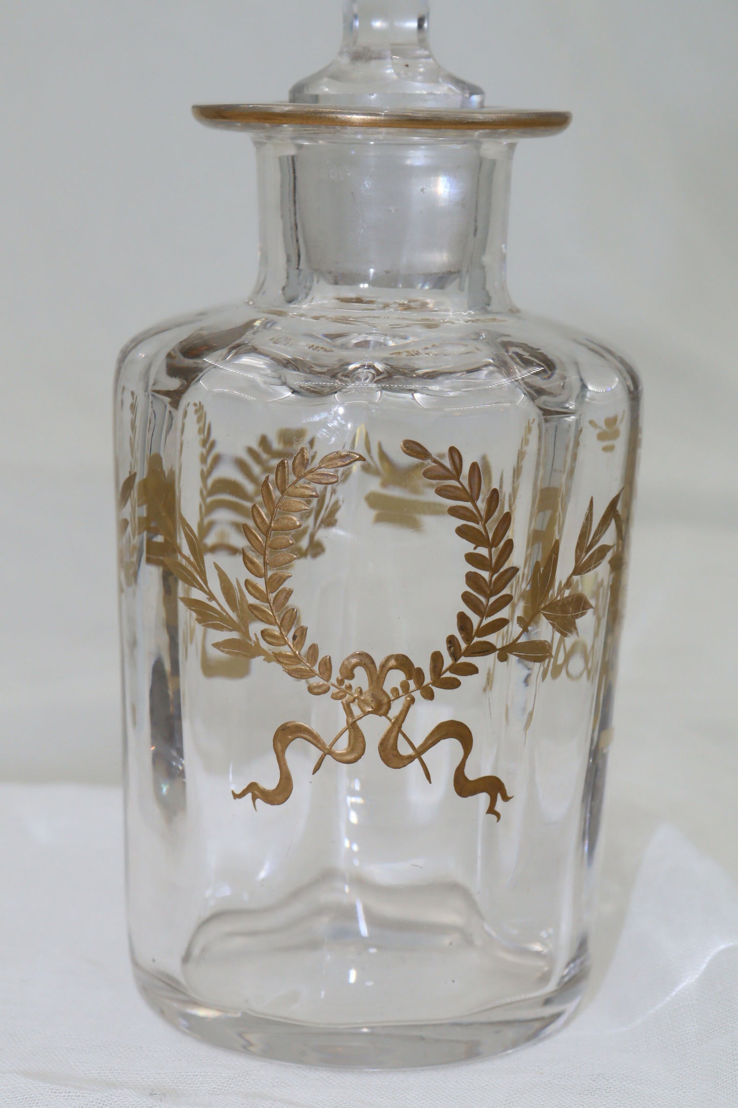 Glass perfume bottle with gilt laurel wreaths