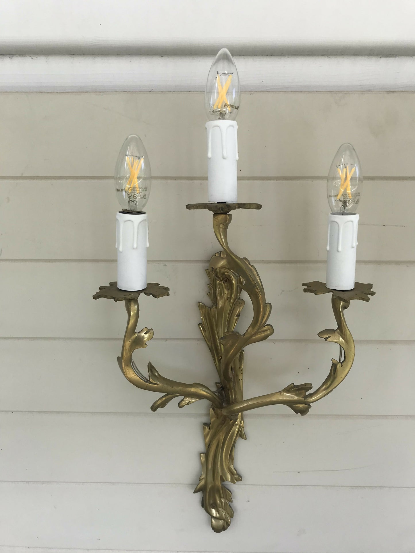 Pair of solid brass rococo wall sconces