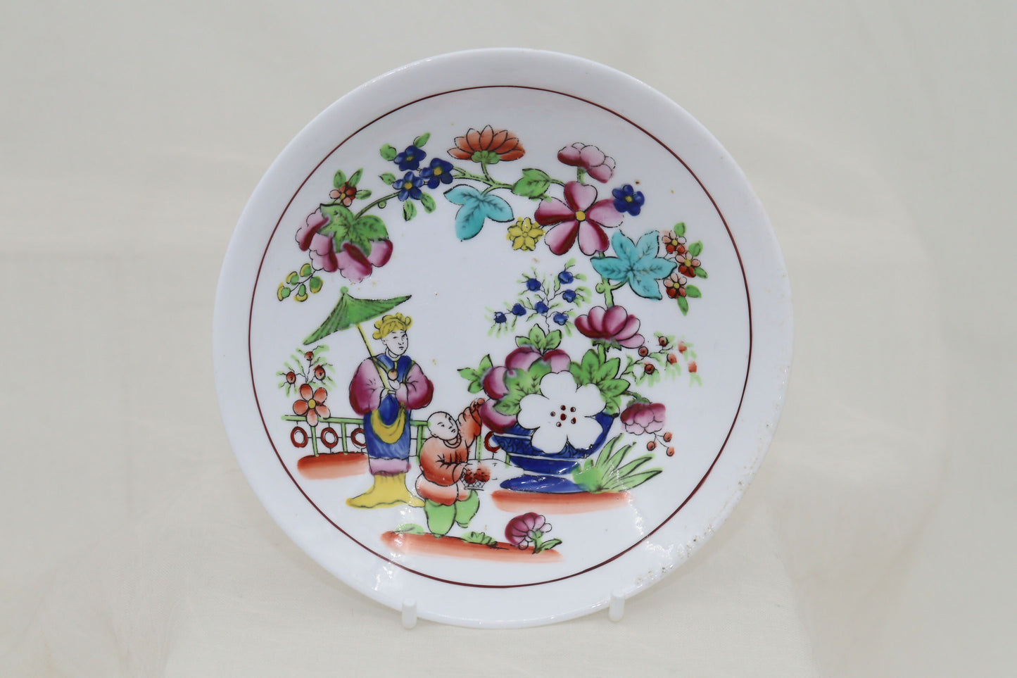 Set of four hand coloured cups and saucers by Hilditch