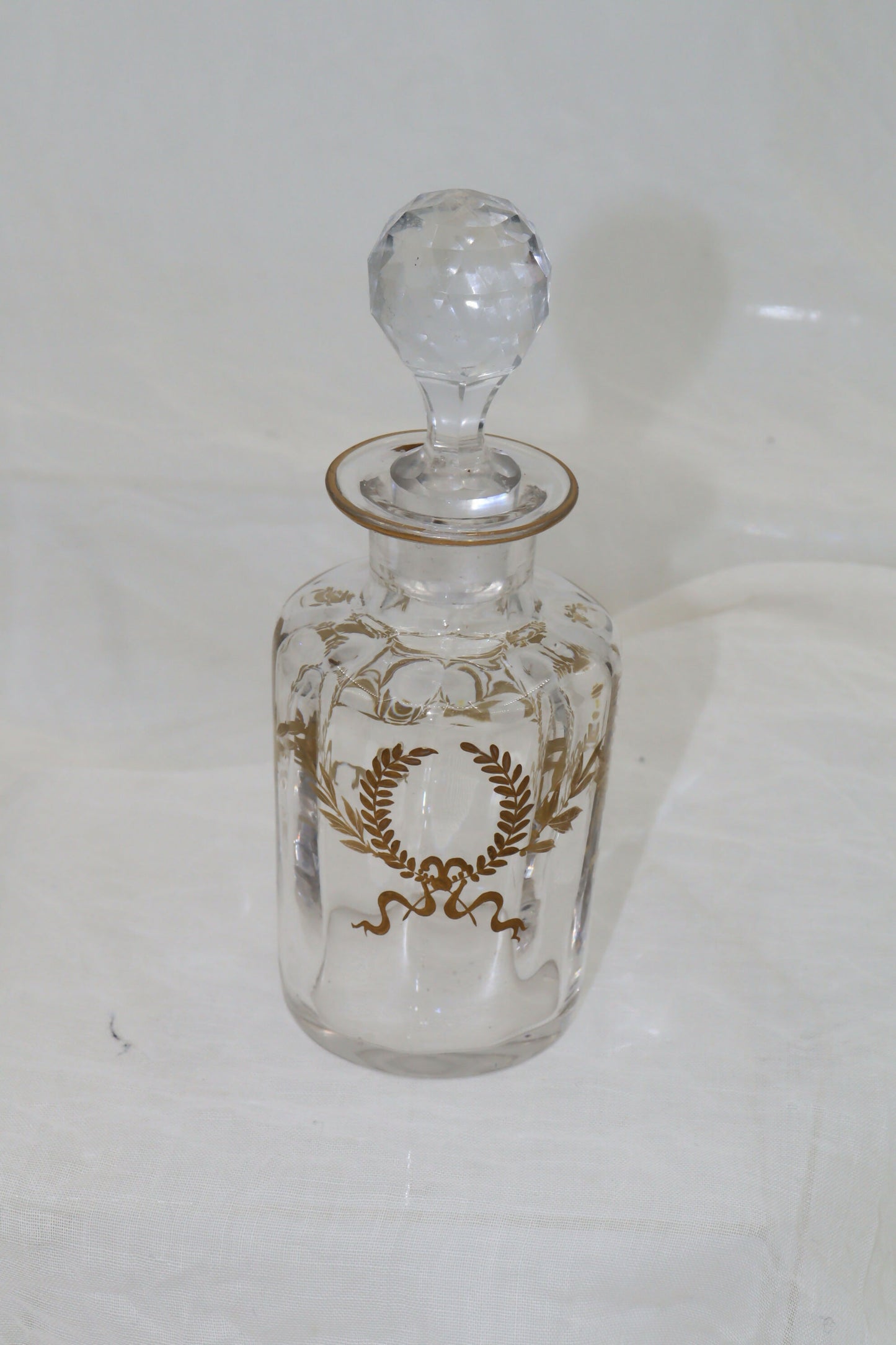 Glass perfume bottle with gilt laurel wreaths