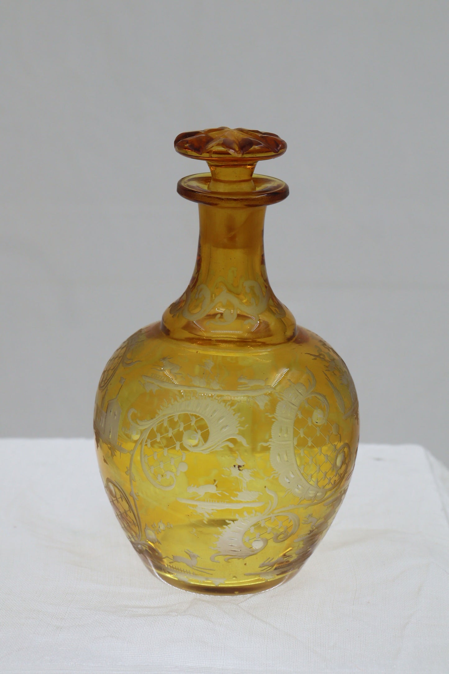 Engraved amber glass perfume bottle