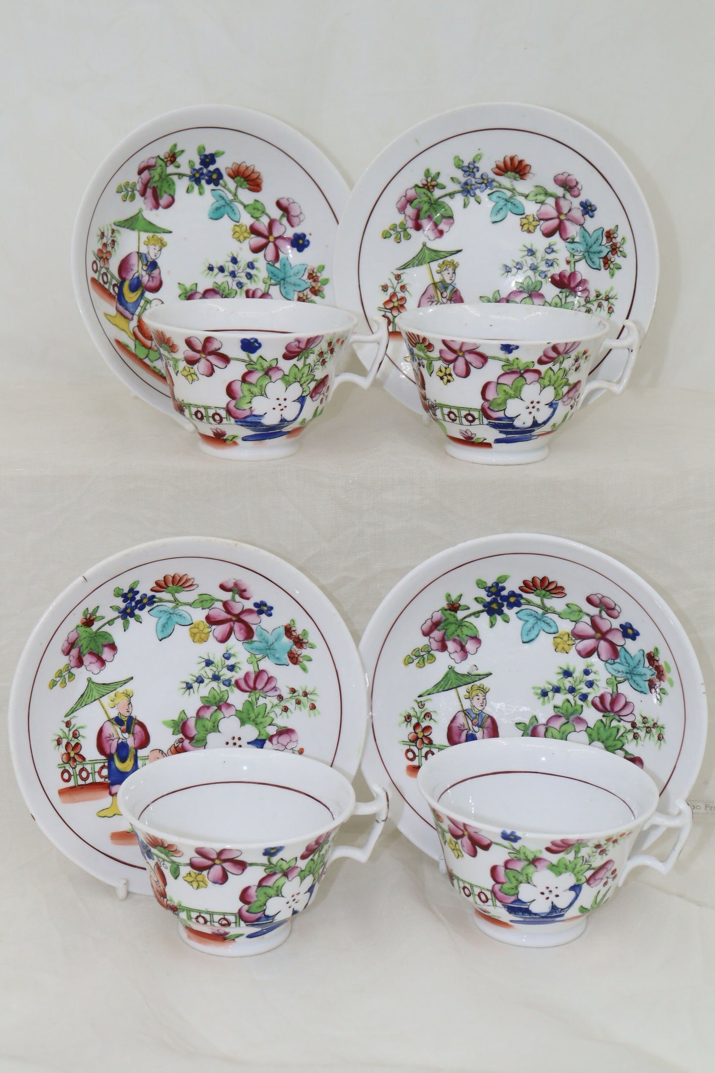 Set of four hand coloured cups and saucers by Hilditch