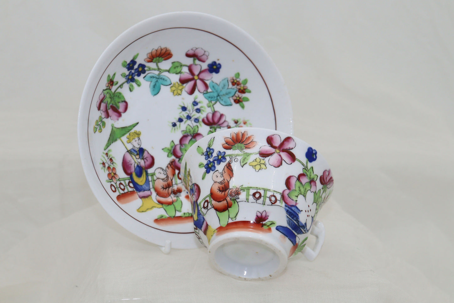 Set of four hand coloured cups and saucers by Hilditch