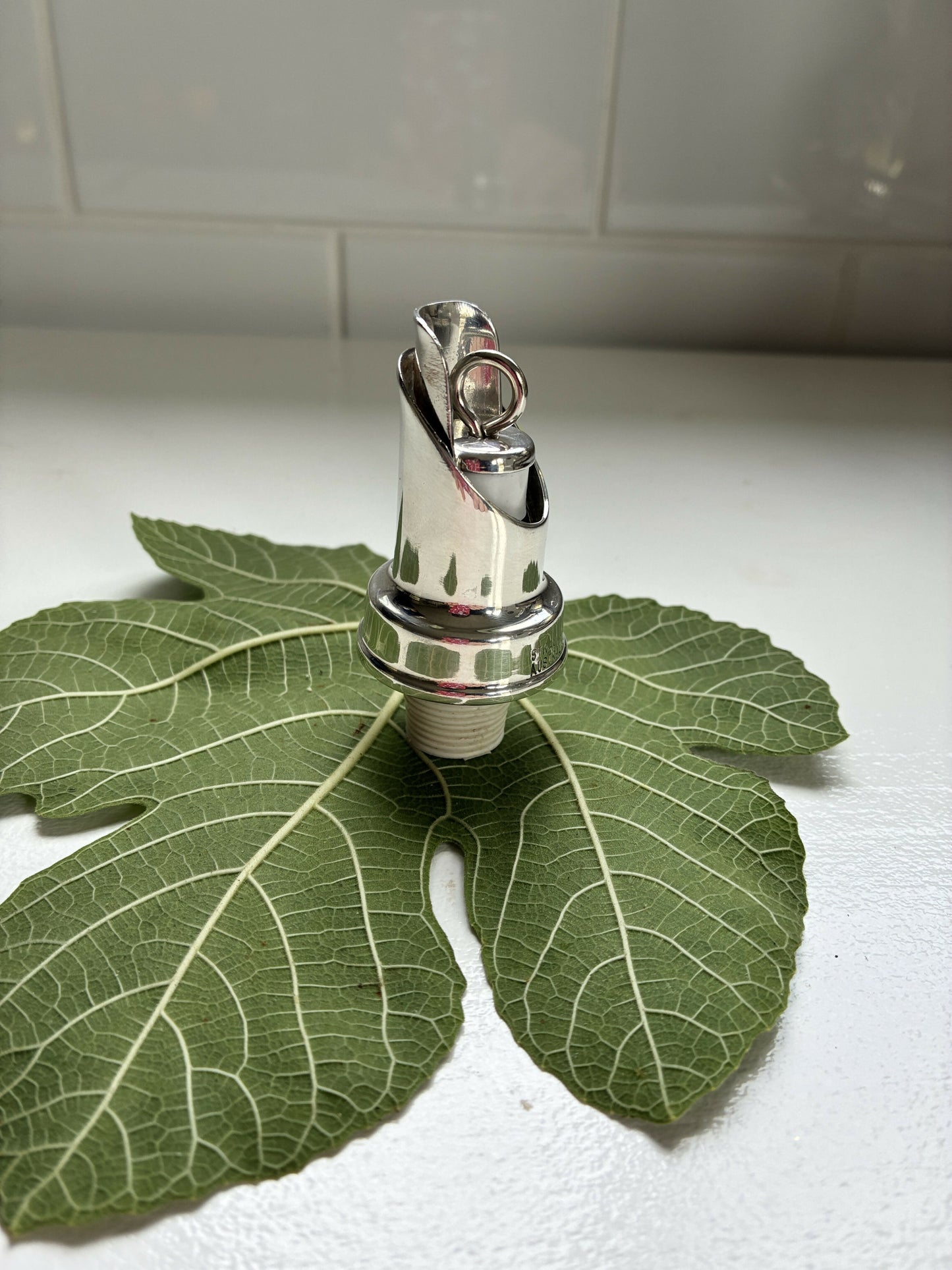 Silver wine pourer