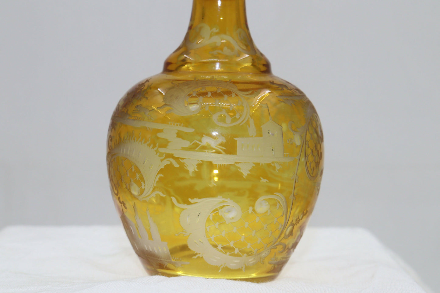 Engraved amber glass perfume bottle
