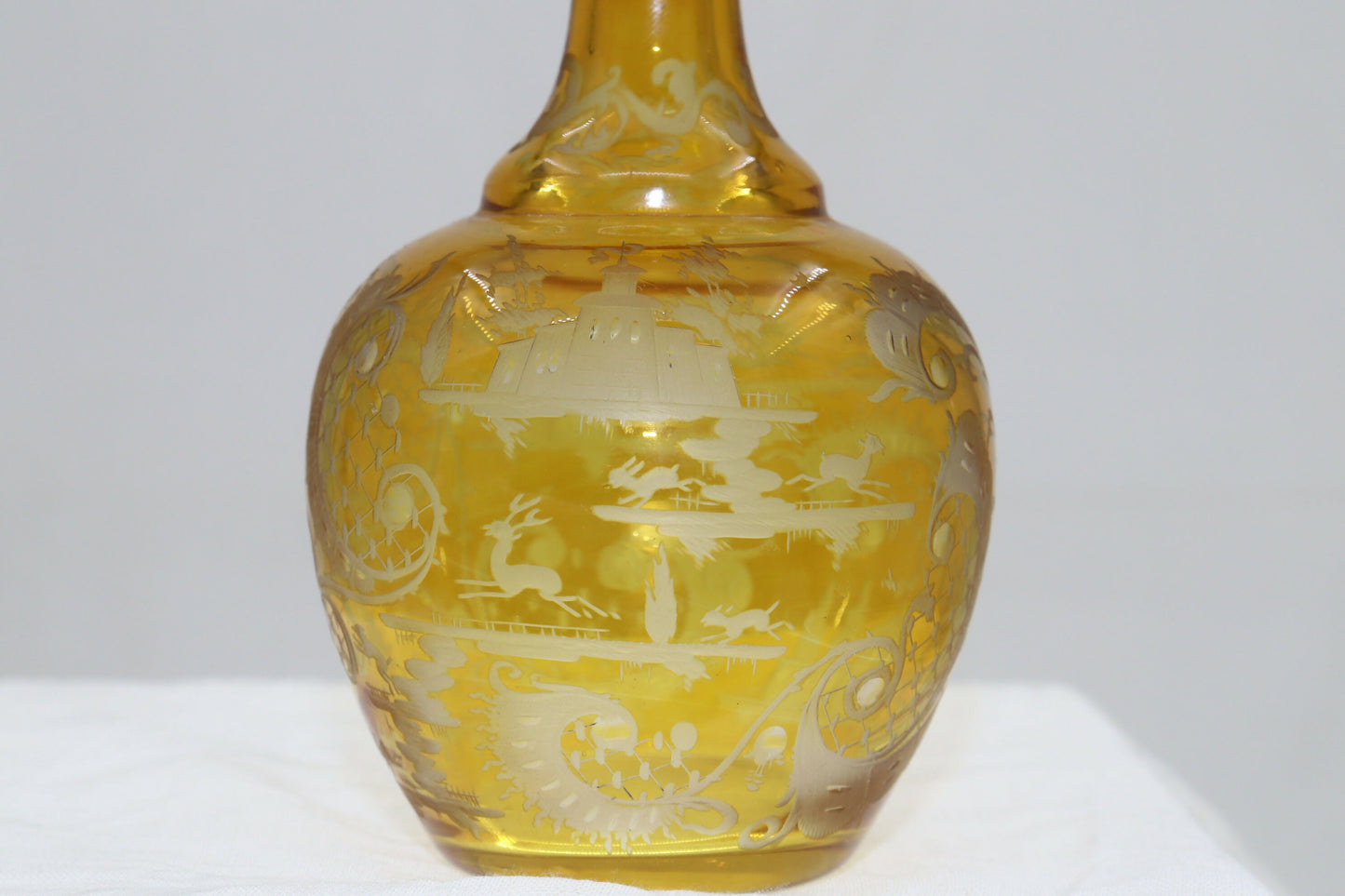 Engraved amber glass perfume bottle