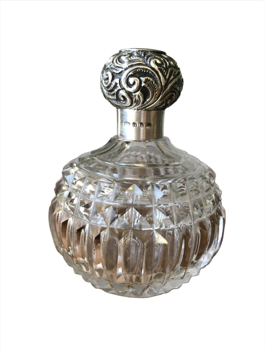 Silver topped scent perfume bottle